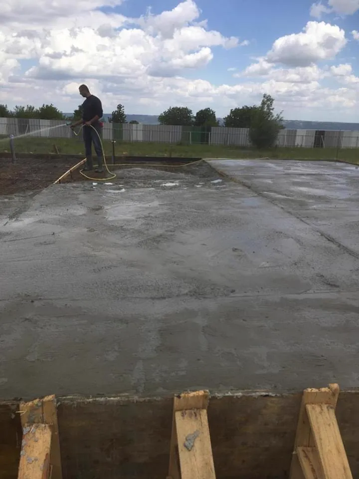 Smoothing the wet concrete surface.