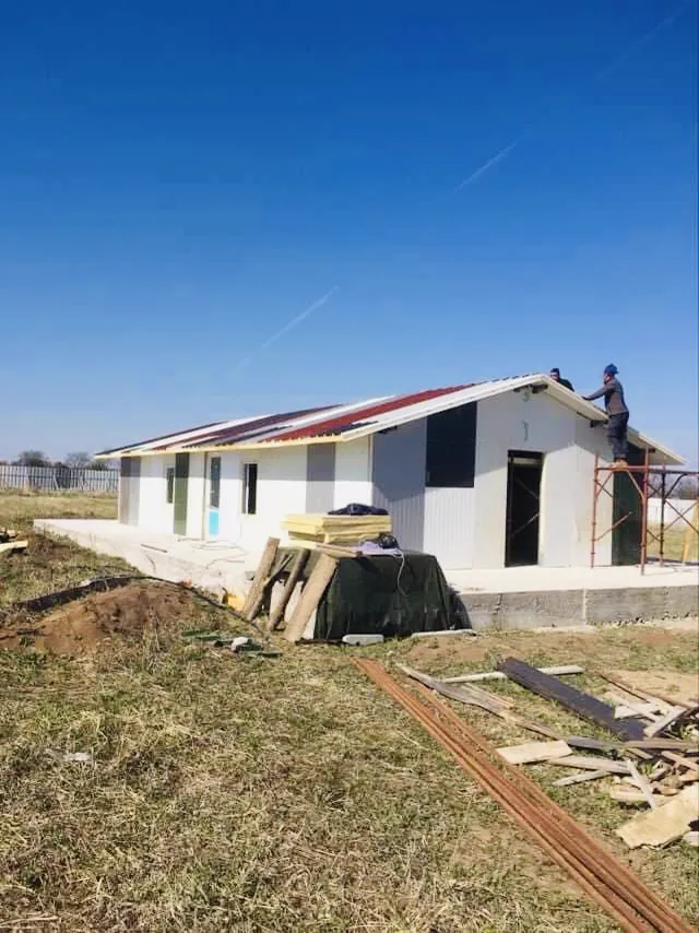 Working on the roof of the main building.