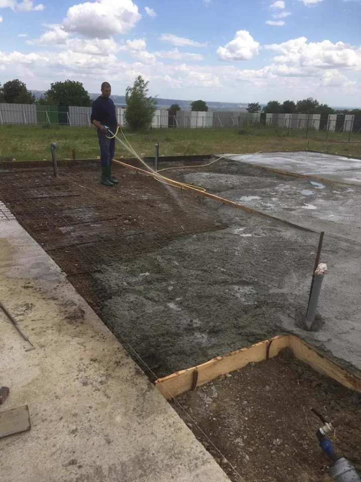 The finished slab being cured with water.